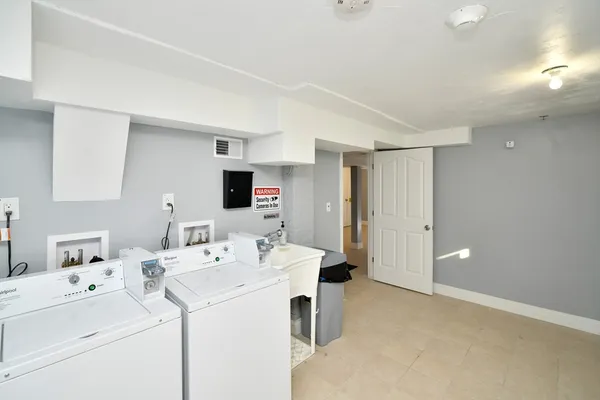 a view of bathroom with dual sinks
