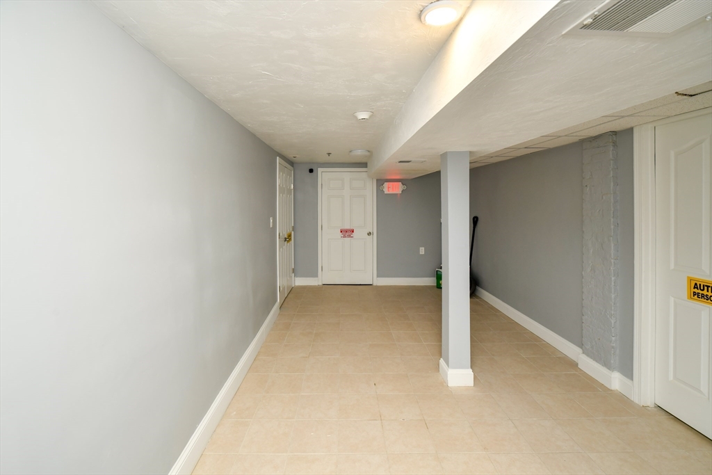 55 Dale Street, Unit 3 Boston, MA 02119 - Photo 23 of 24 a view of a hallway