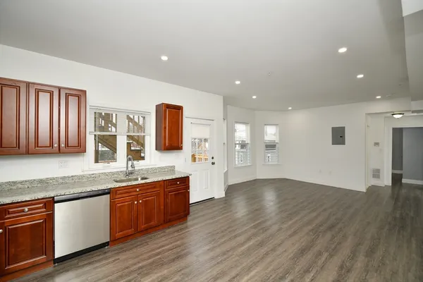 a view of a kitchen with a sink and dish washer