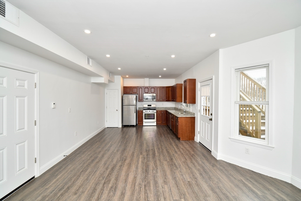 55 Dale Street, Unit 3 Boston, MA 02119 - Photo 7 of 24 a view of kitchen with wooden floor