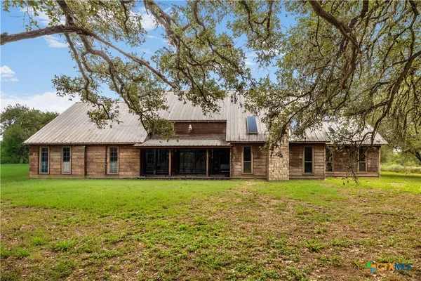 front view of a house with a big yard