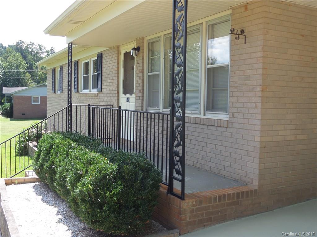 145 Evergreen Road, Unit 18 Lancaster, SC 29720 - Photo 3 of 36 a view of a house with a small yard and wooden floor and fence