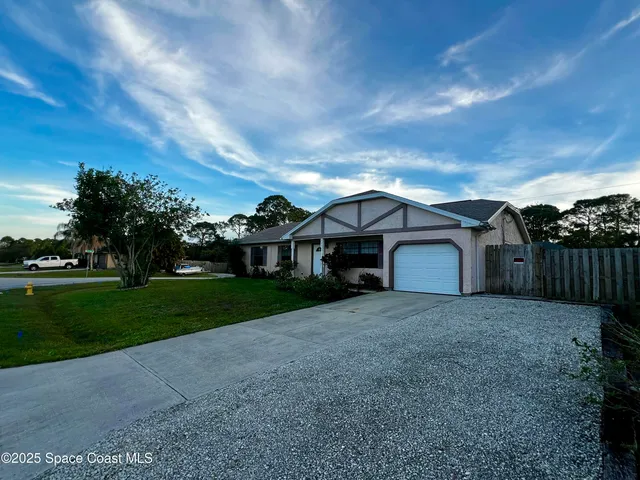 a house view with a garden space
