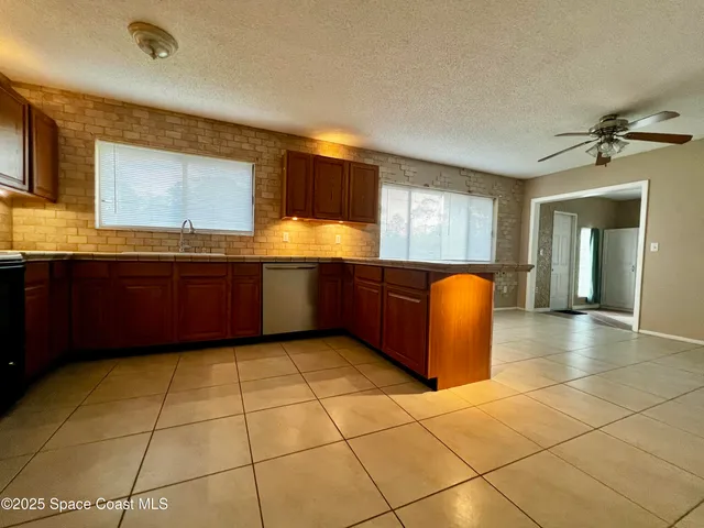 a large bathroom with a large tub and sink