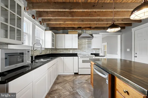 a kitchen with a stove and a sink