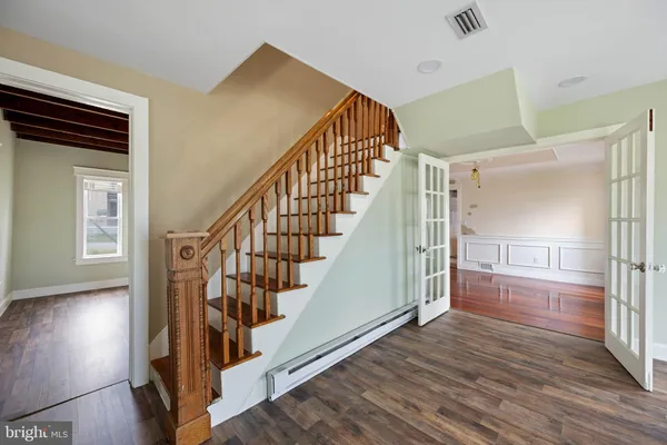 a view of entryway with wooden floor