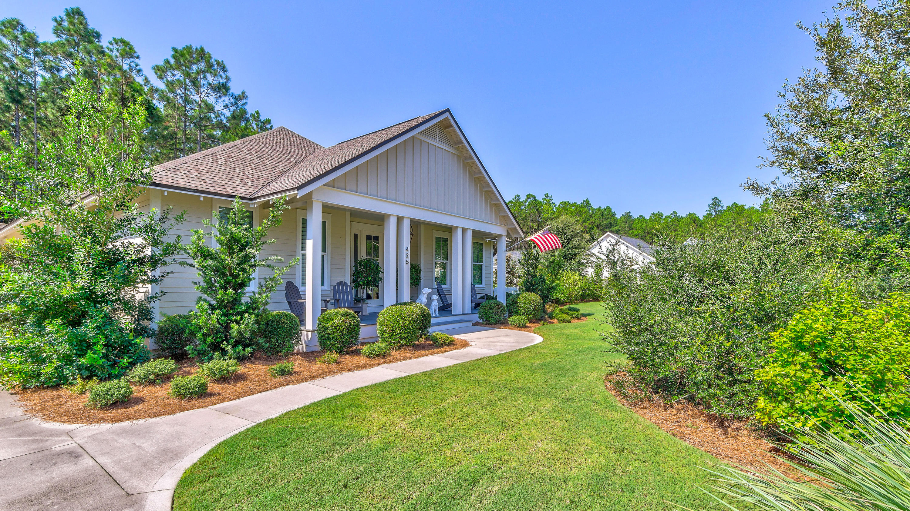 425 Medley Street Watersound, FL 32461 - Photo 2 of 29 a view of a house with garden and yard