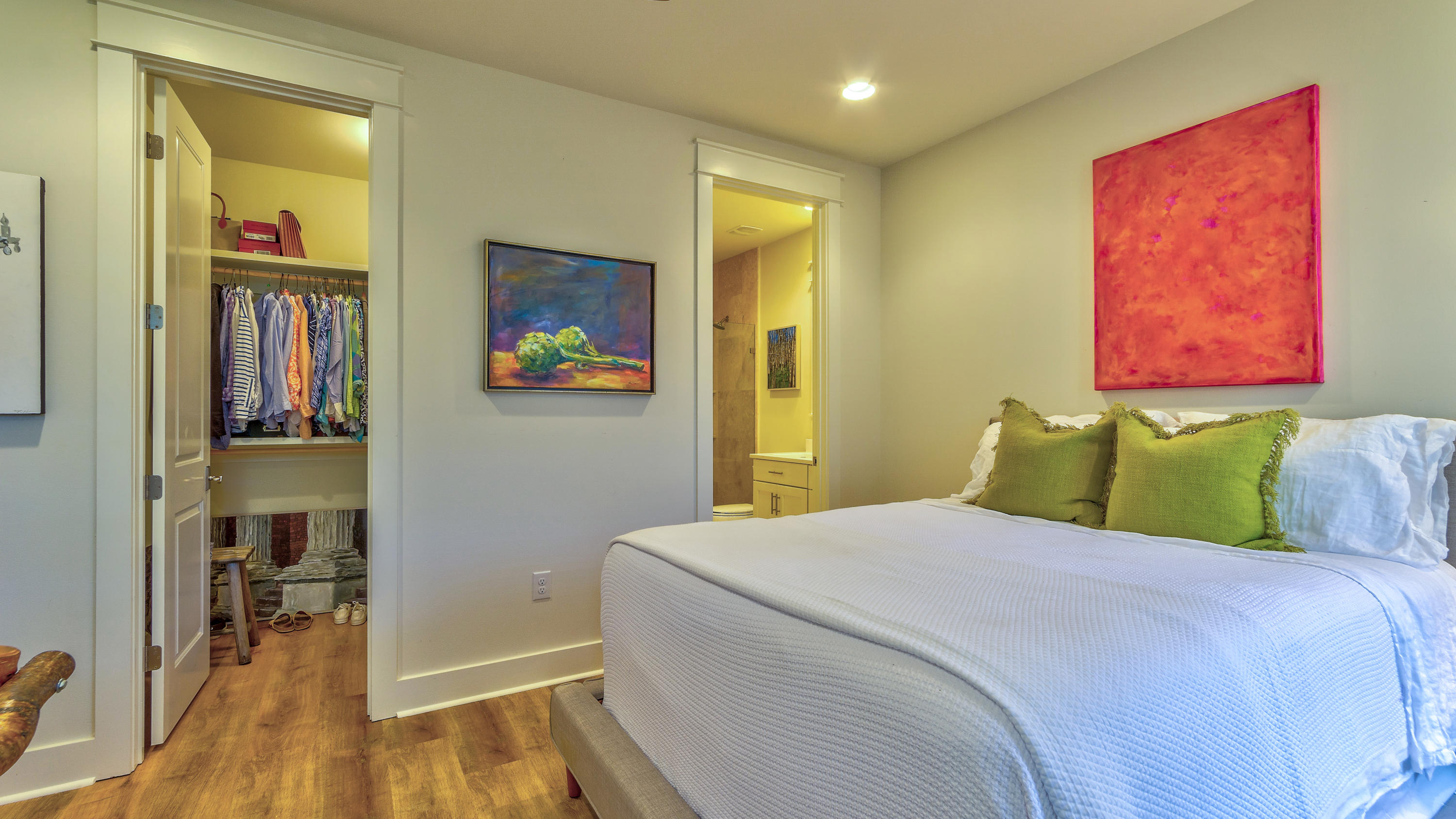 425 Medley Street Watersound, FL 32461 - Photo 17 of 29 a bedroom with a bed and a painting on the wall