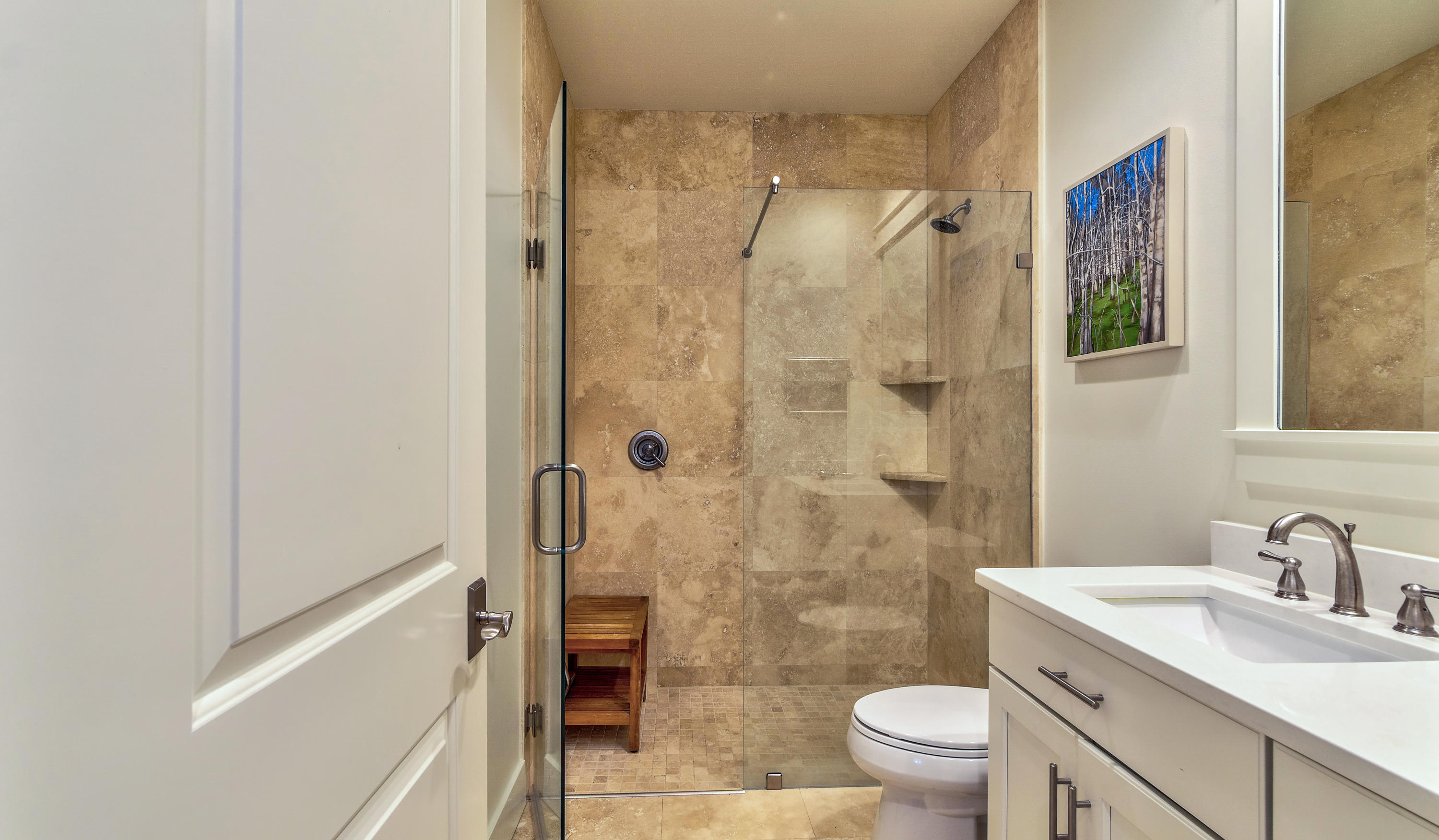425 Medley Street Watersound, FL 32461 - Photo 18 of 29 a bathroom with a granite countertop sink toilet and shower