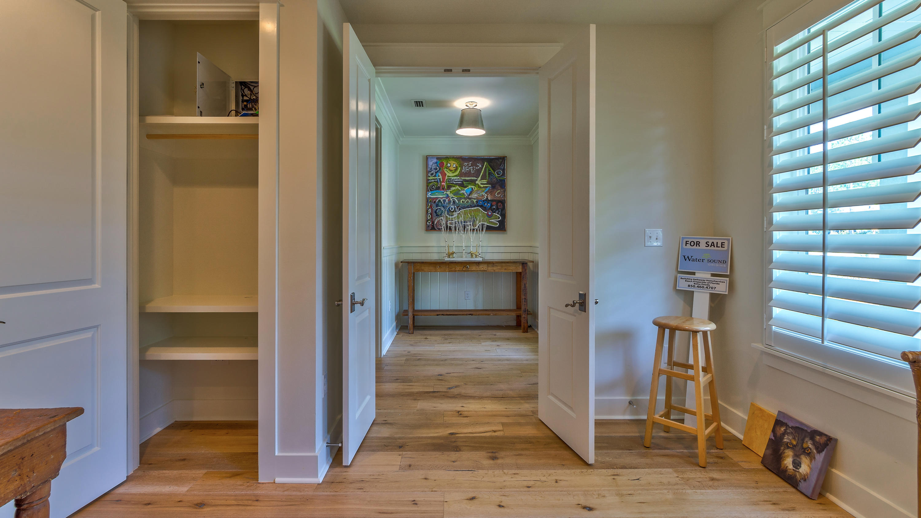 425 Medley Street Watersound, FL 32461 - Photo 20 of 29 a view of a hallway with wooden floor and windows