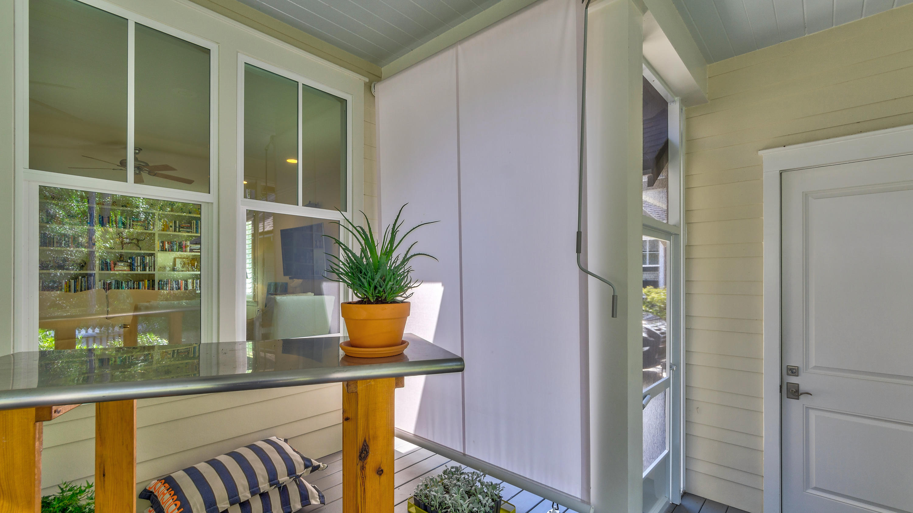 425 Medley Street Watersound, FL 32461 - Photo 23 of 29 a view of a glass door with a balcony and chair