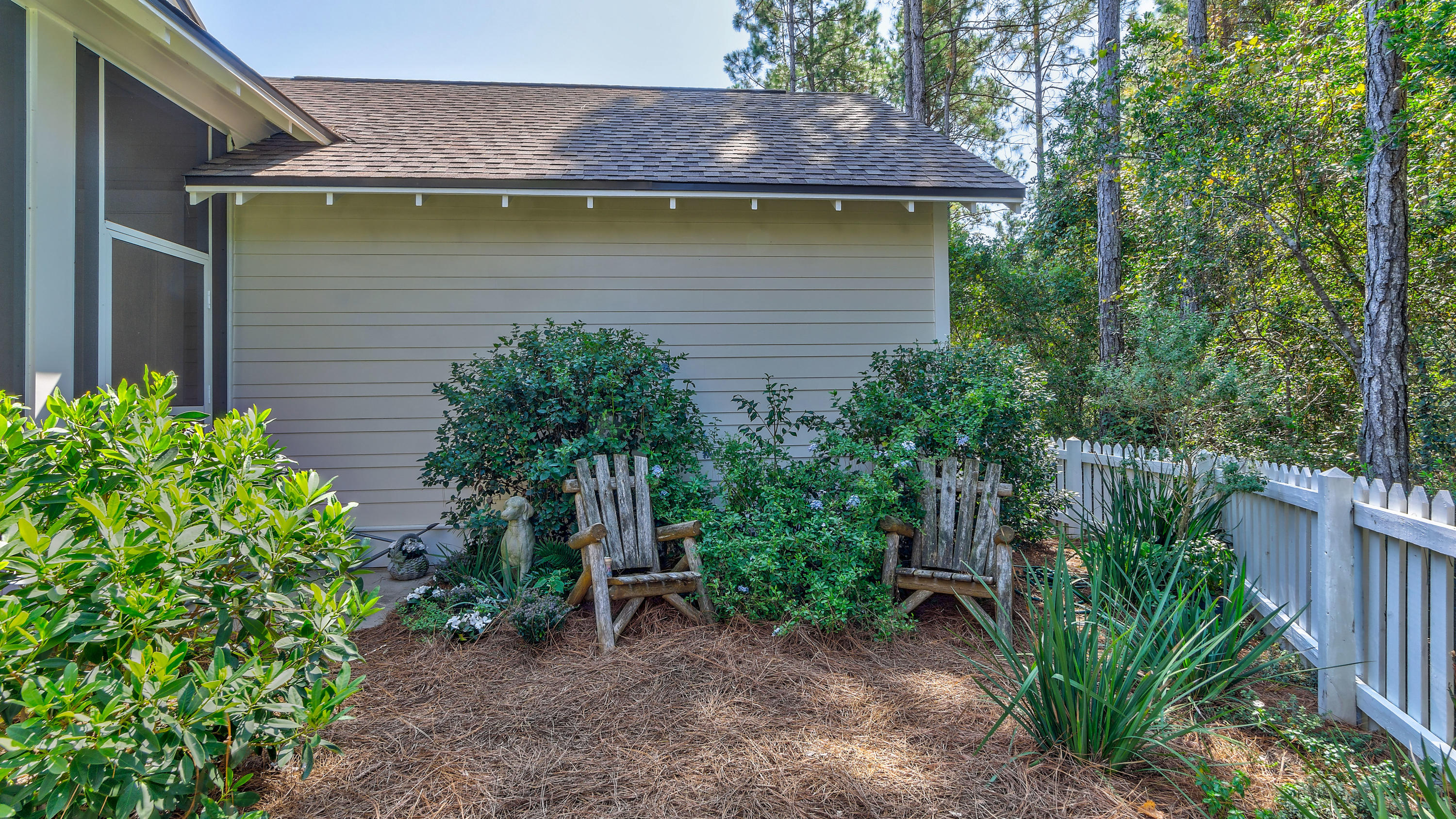 425 Medley Street Watersound, FL 32461 - Photo 25 of 29 a view of a house with a yard and sitting area