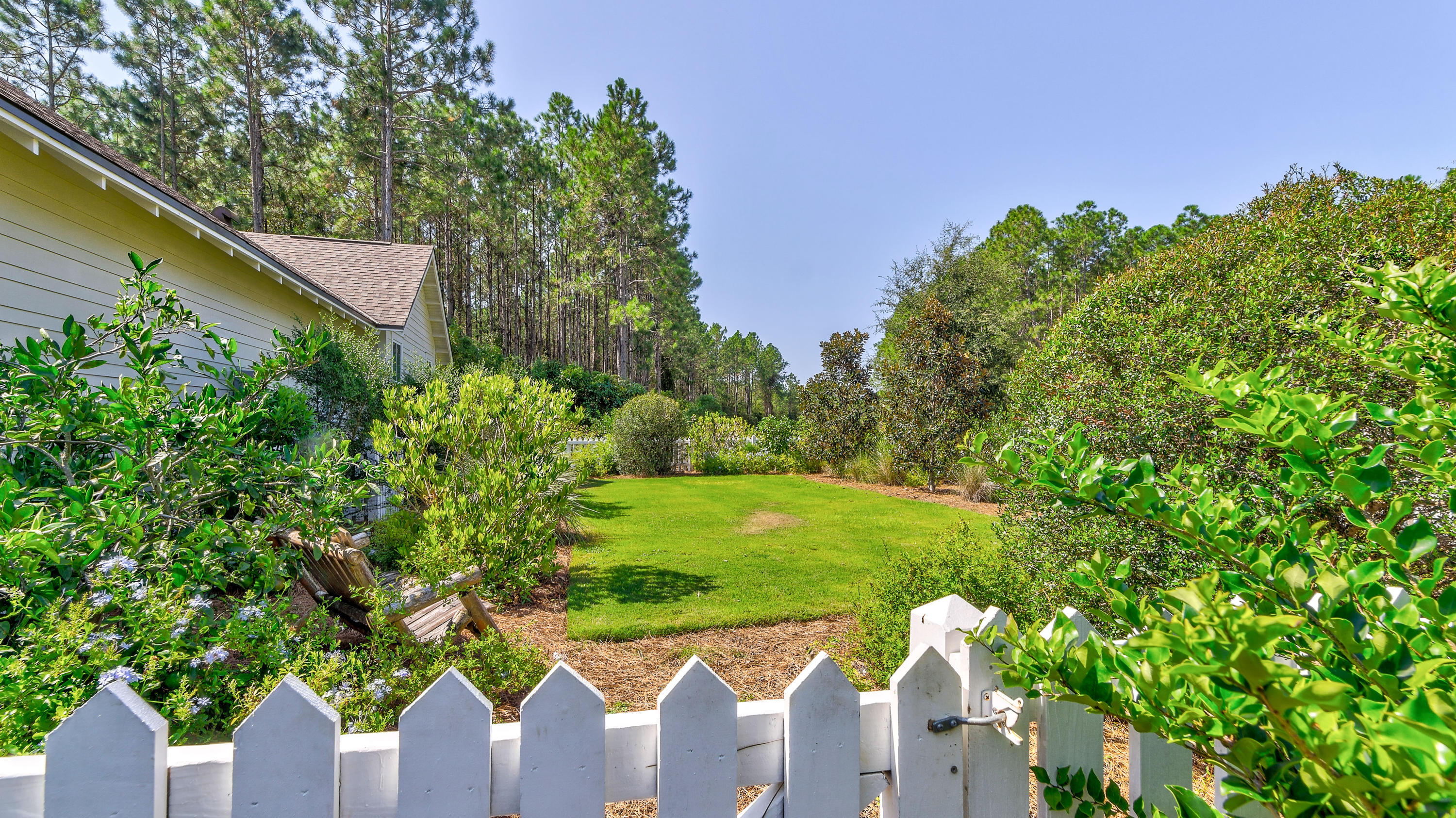 425 Medley Street Watersound, FL 32461 - Photo 28 of 29 a wooden fence with some trees in the background