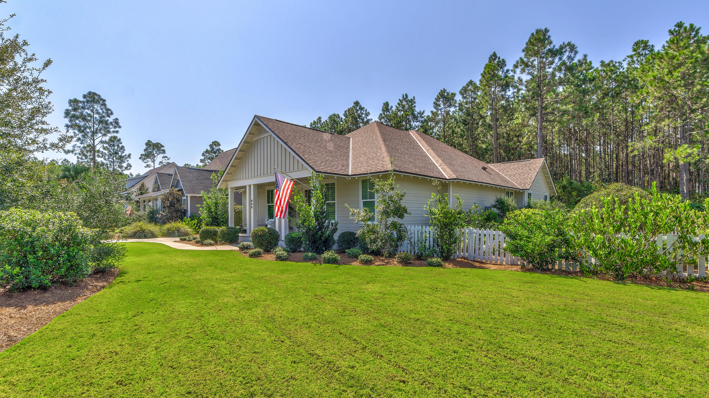 425 Medley Street Watersound, FL 32461 - Photo 4 of 29 a view of a house with garden and yard