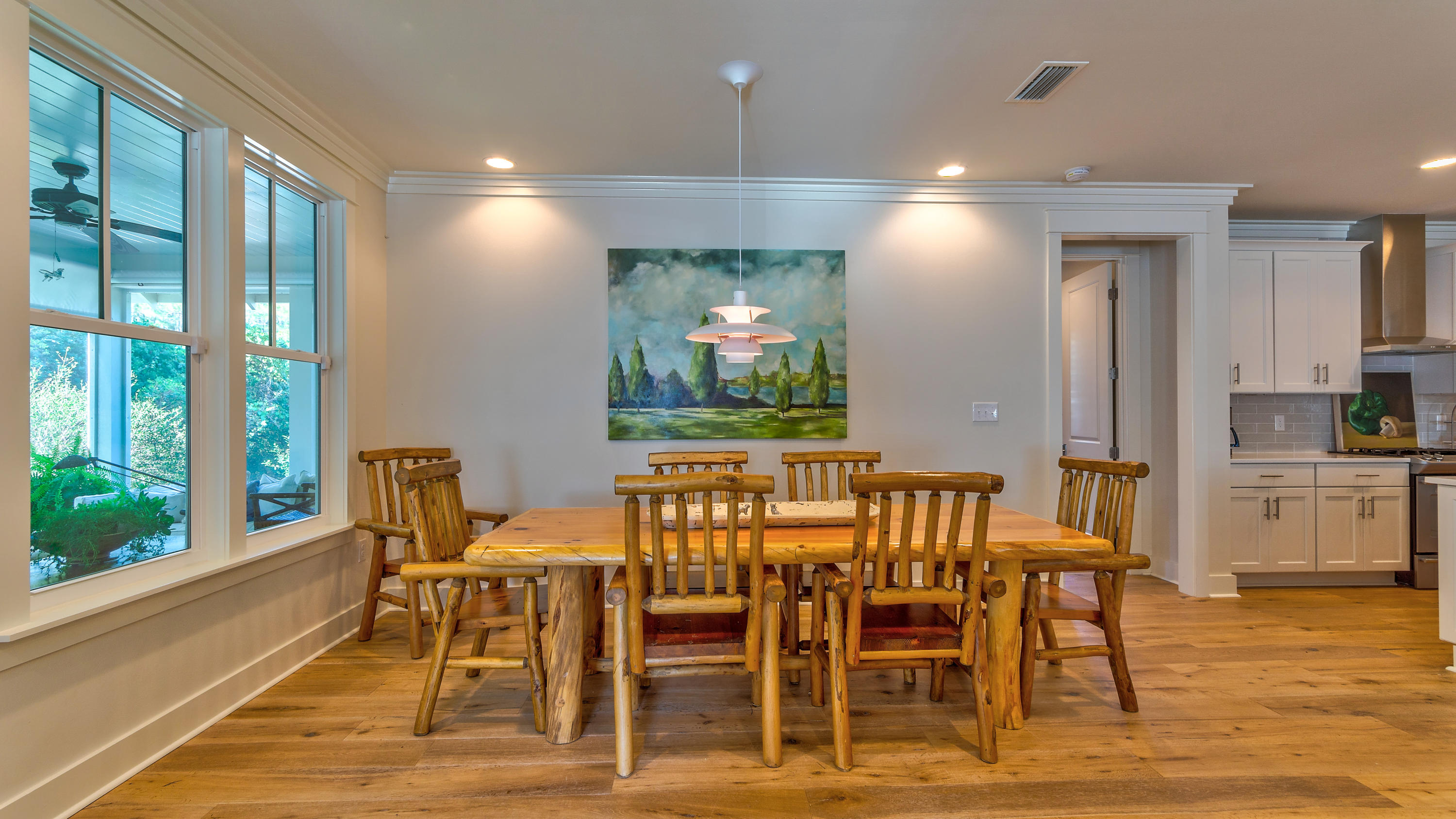 425 Medley Street Watersound, FL 32461 - Photo 6 of 29 a view of a dining room with furniture window and wooden floor