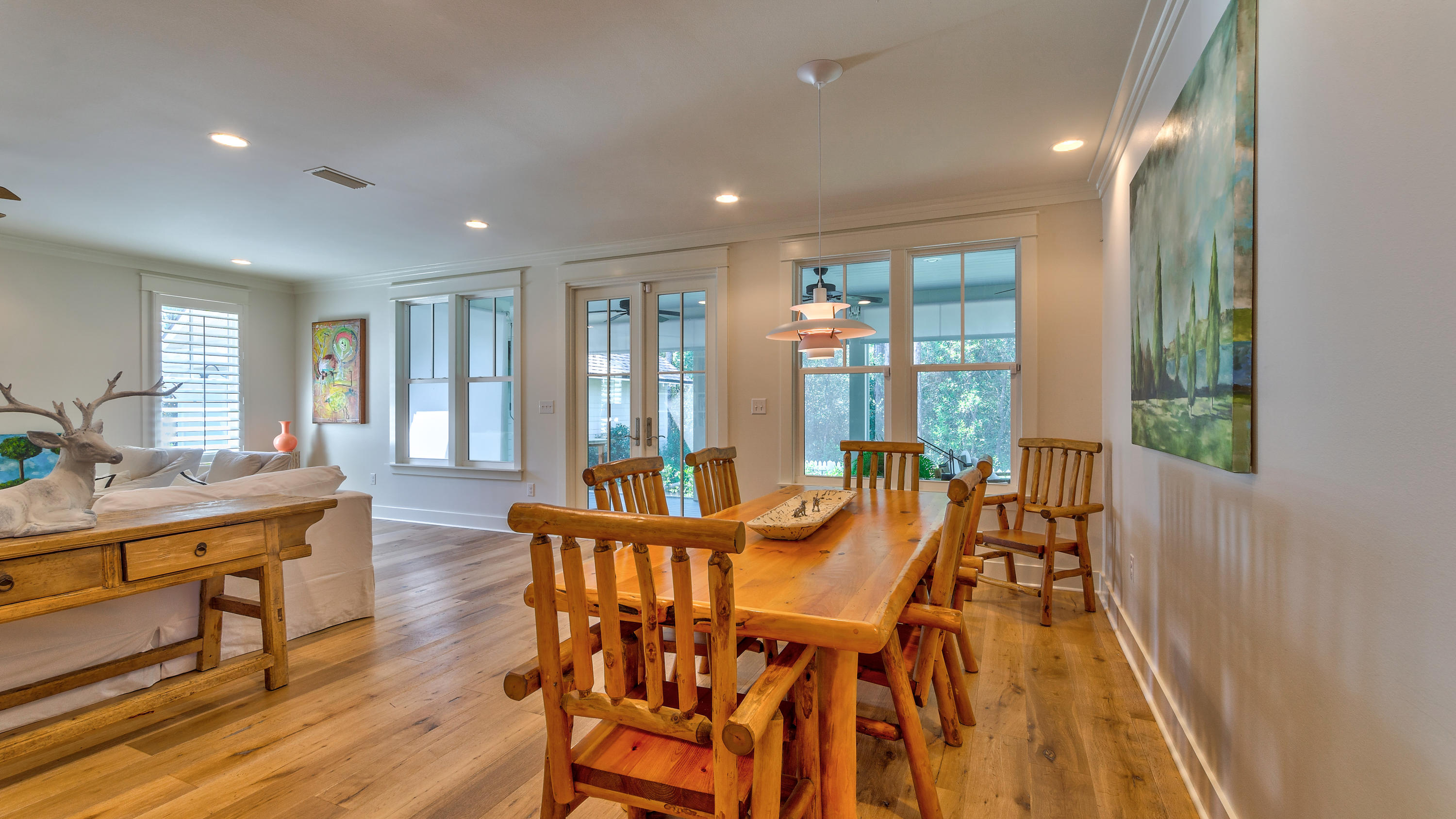 425 Medley Street Watersound, FL 32461 - Photo 9 of 29 a view of a dining room with furniture window and wooden floor