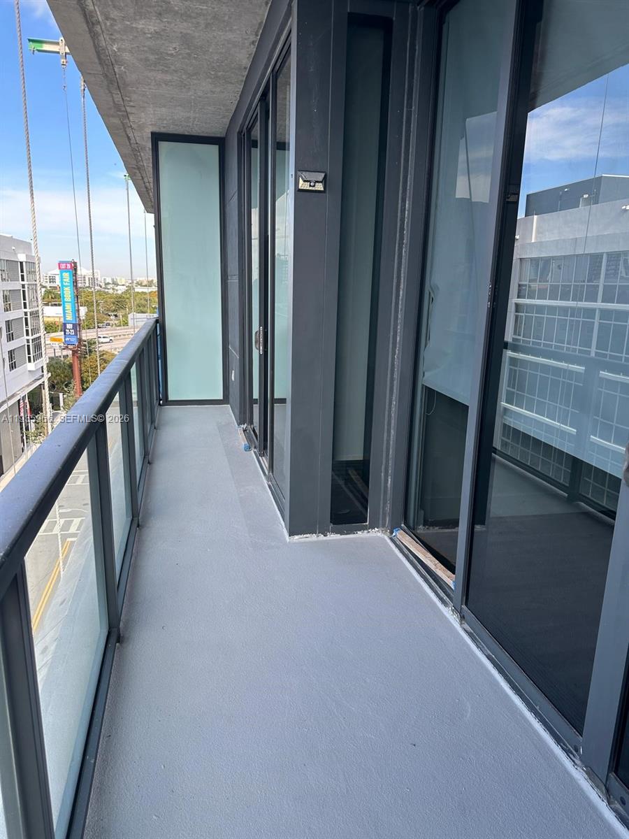 201 Southwest 17th Road, Unit 803 Miami, FL 33129 - Photo 20 of 22 a view of a hallway with windows