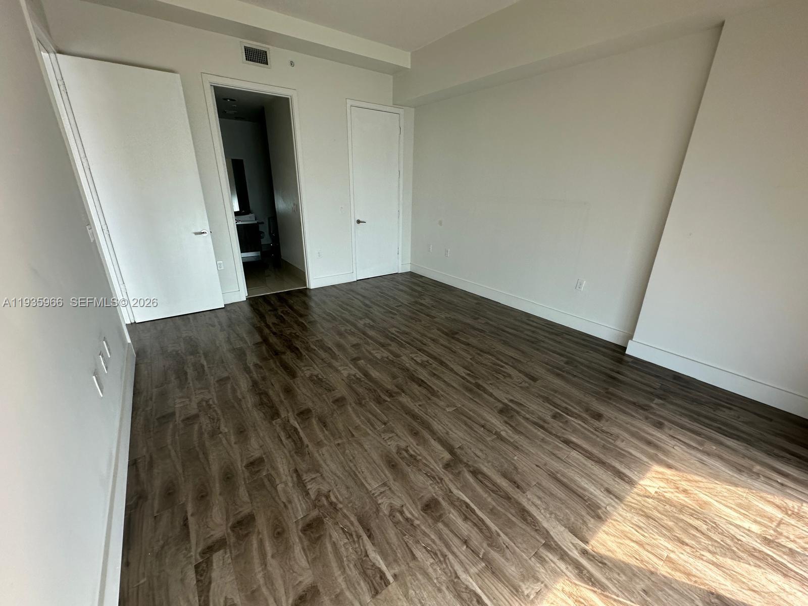 201 Southwest 17th Road, Unit 803 Miami, FL 33129 - Photo 7 of 22 a view of hallway with wooden floor