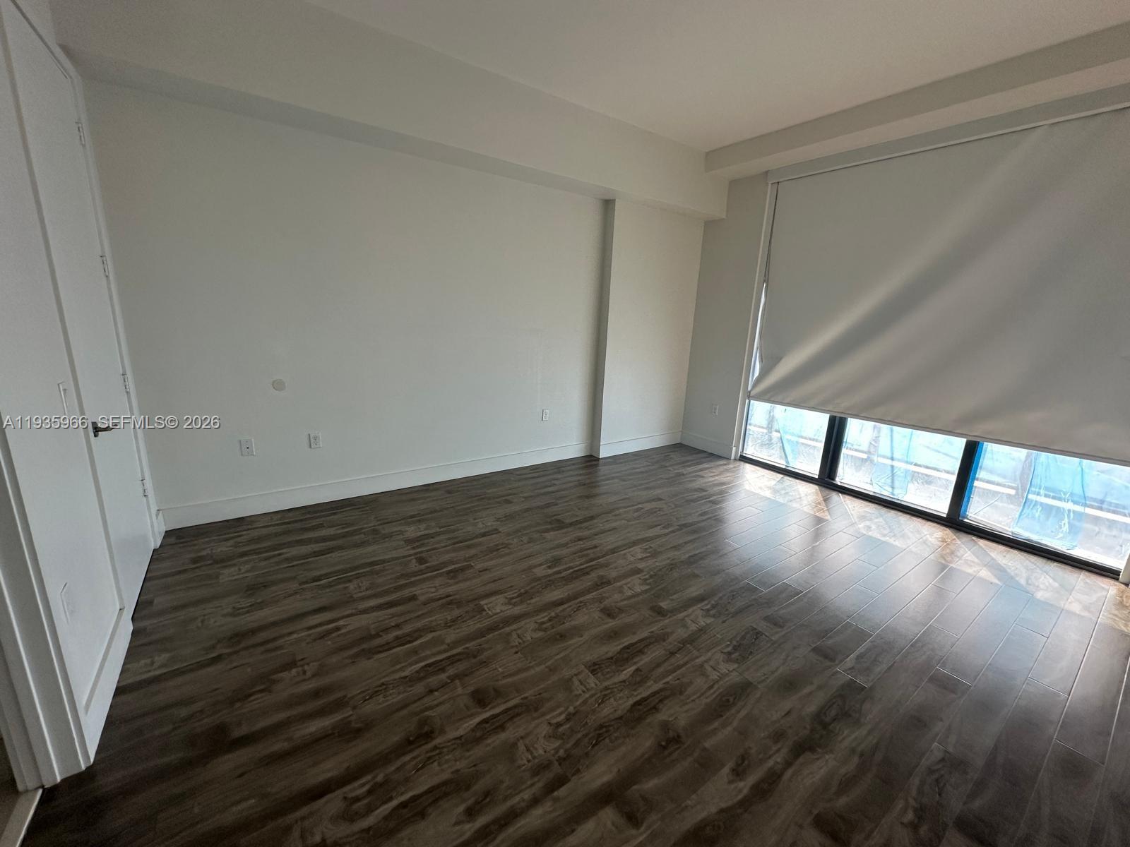 201 Southwest 17th Road, Unit 803 Miami, FL 33129 - Photo 8 of 22 a view of a room with wooden floor