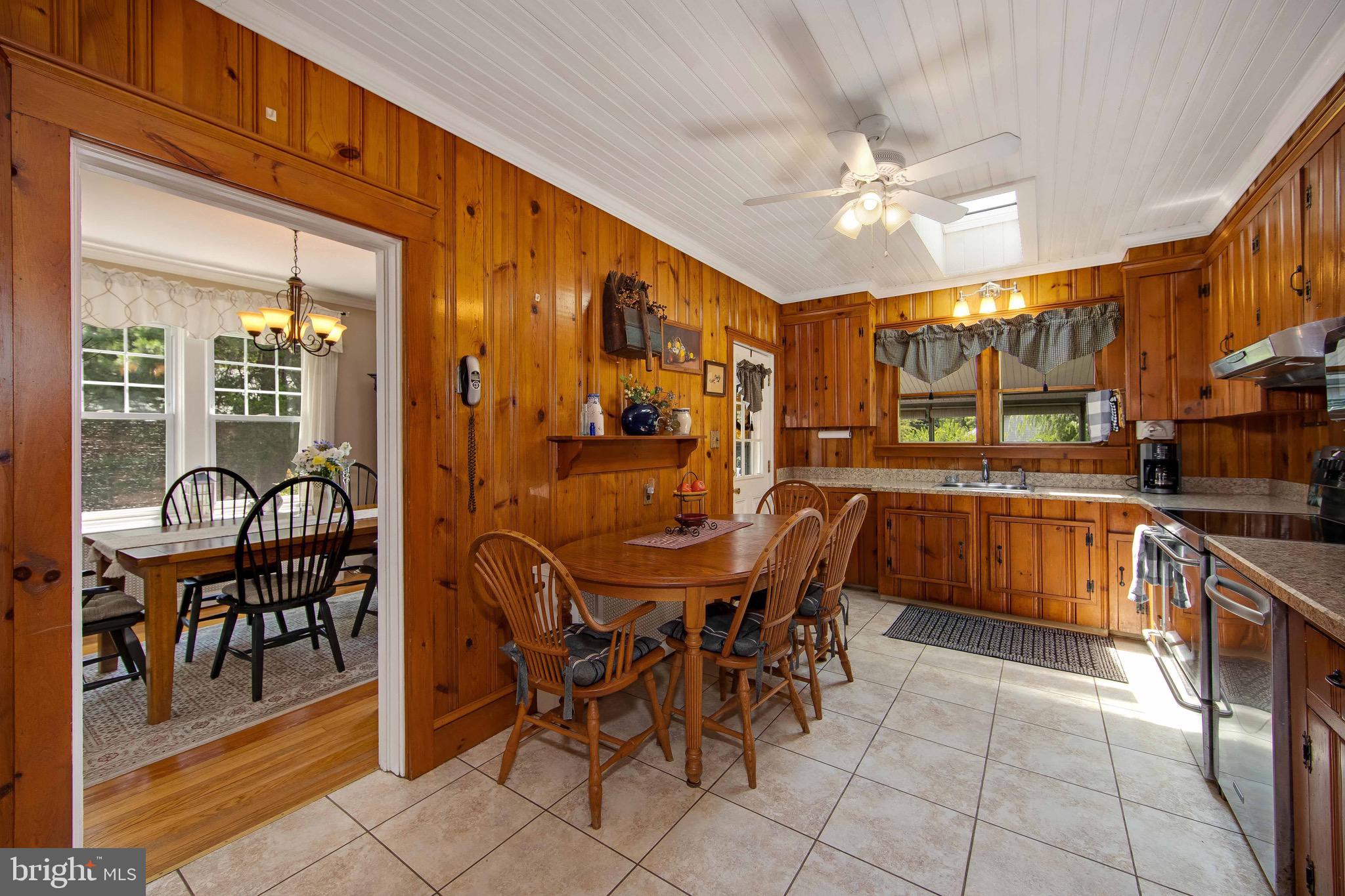106 4 Mile Road Pemberton, NJ 08068 - Photo 11 of 42 a dining hall with stainless steel appliances a dining table and chairs