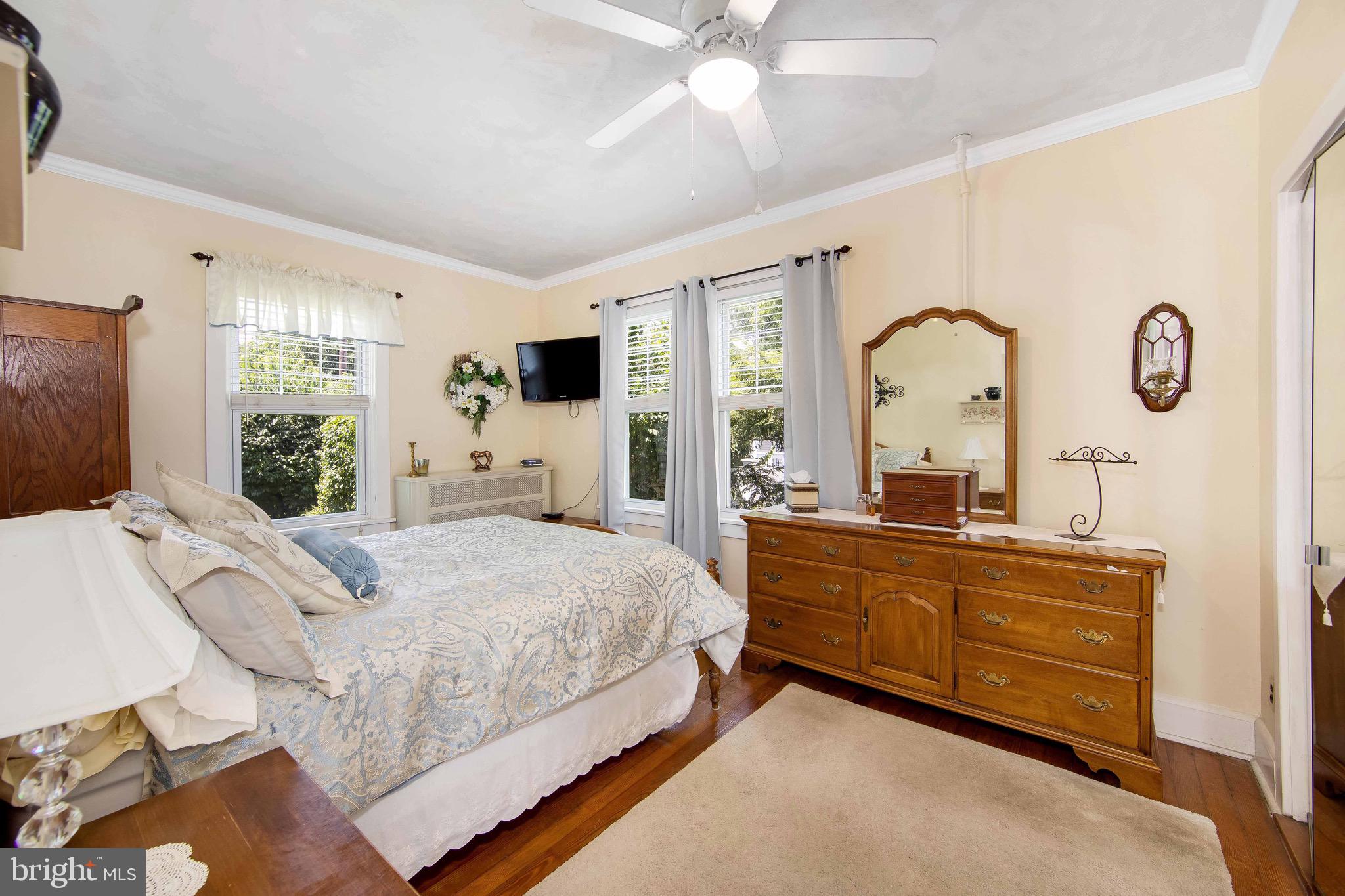 106 4 Mile Road Pemberton, NJ 08068 - Photo 17 of 42 a bed room with a bed and dresser