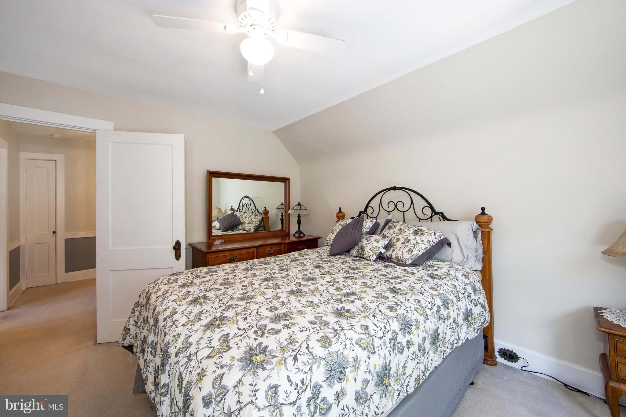 106 4 Mile Road Pemberton, NJ 08068 - Photo 21 of 42 a bedroom with a bed and a painting on the wall