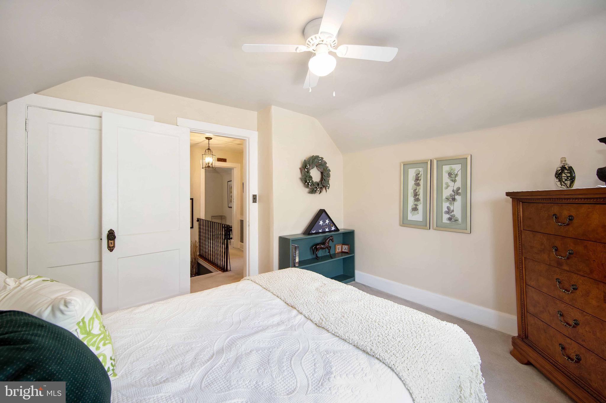 106 4 Mile Road Pemberton, NJ 08068 - Photo 25 of 42 a bedroom with a bed and a chandelier