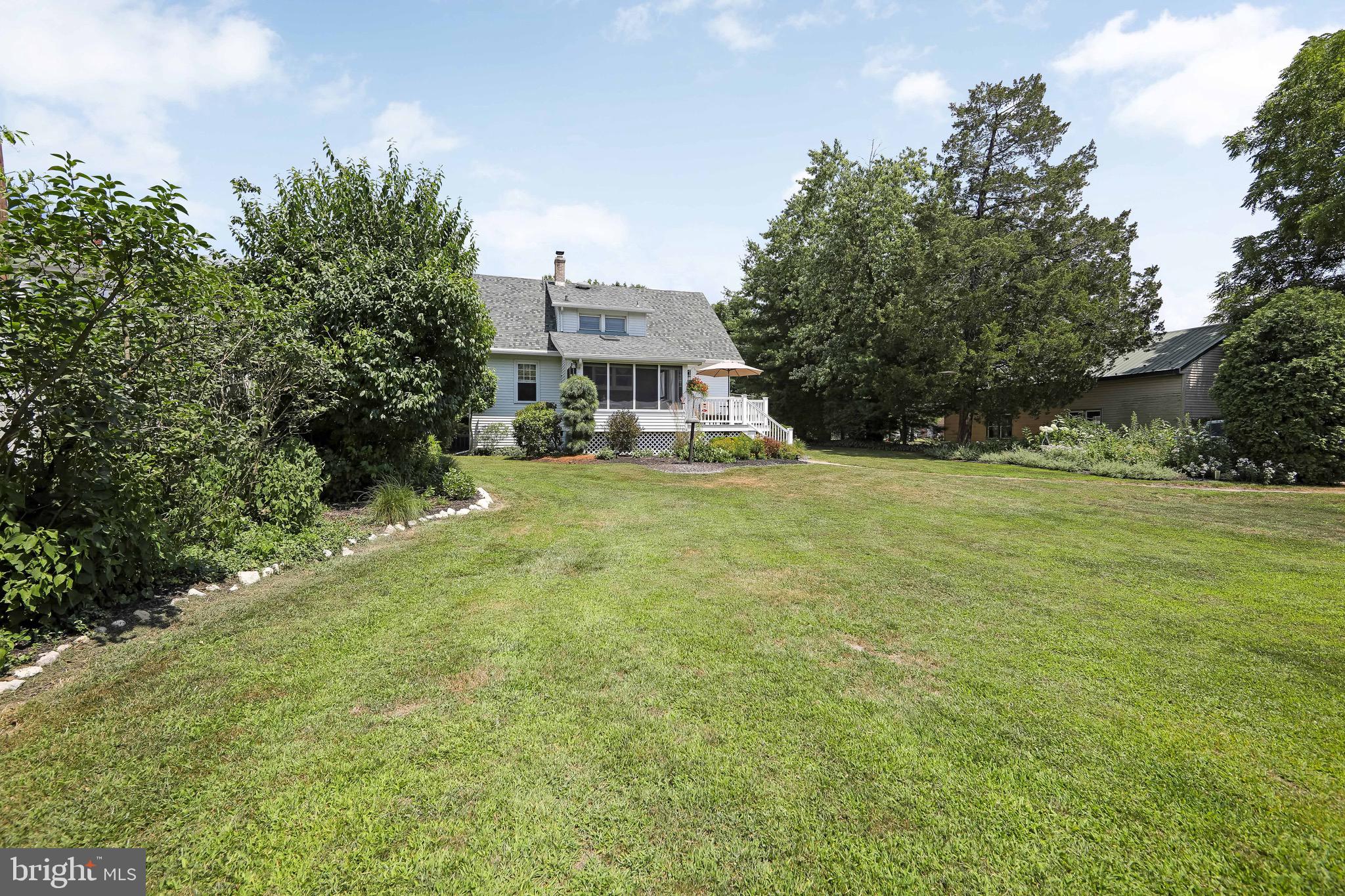 106 4 Mile Road Pemberton, NJ 08068 - Photo 32 of 42 a view of a house with a yard and a garage