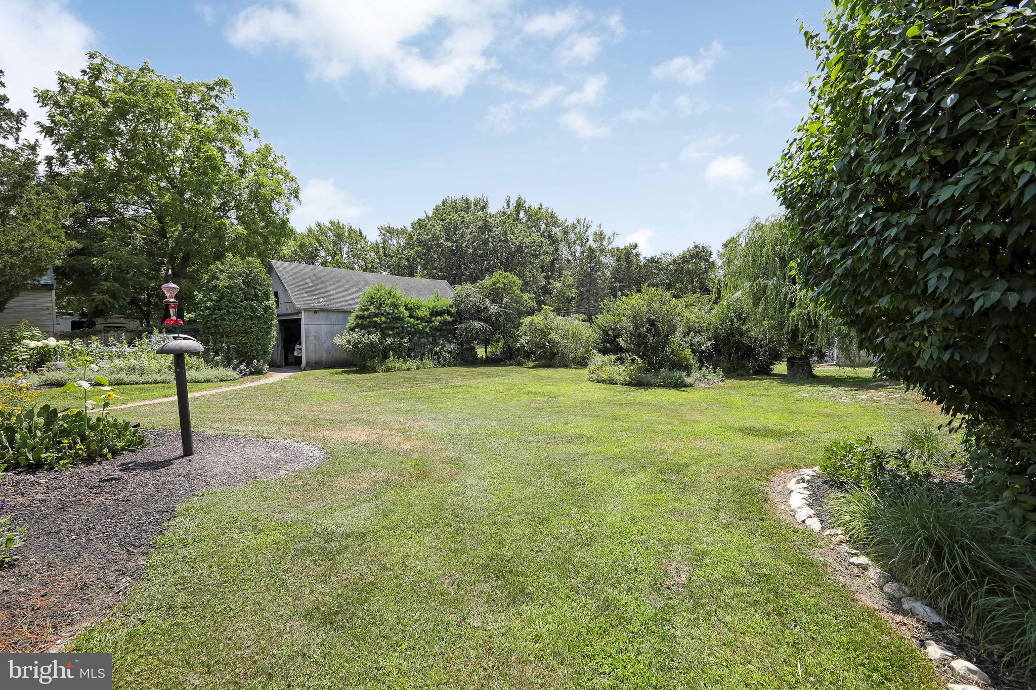106 4 Mile Road Pemberton, NJ 08068 - Photo 33 of 42 a view of a garden with basketball court
