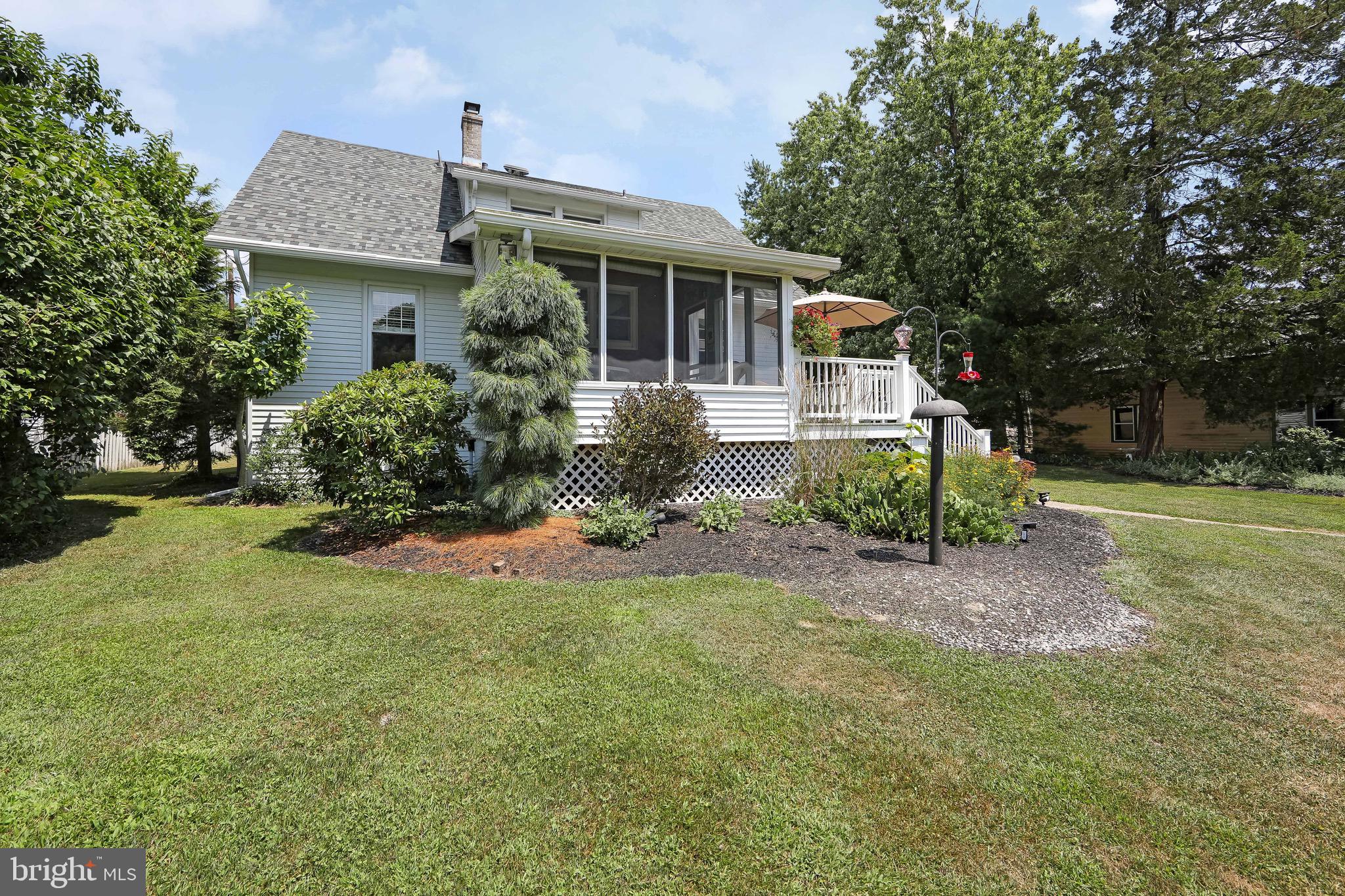 106 4 Mile Road Pemberton, NJ 08068 - Photo 34 of 42 a front view of house with yard and green space
