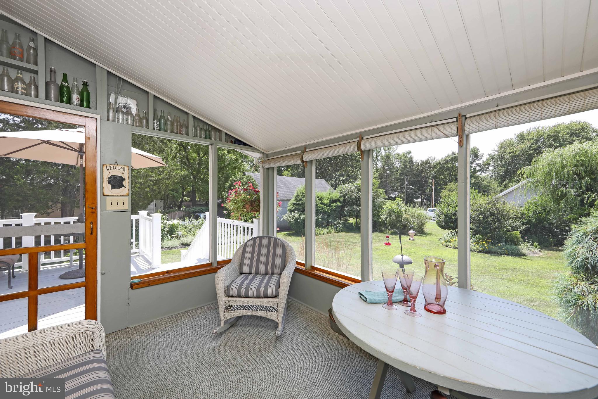106 4 Mile Road Pemberton, NJ 08068 - Photo 38 of 42 a living room with furniture and a floor to ceiling window