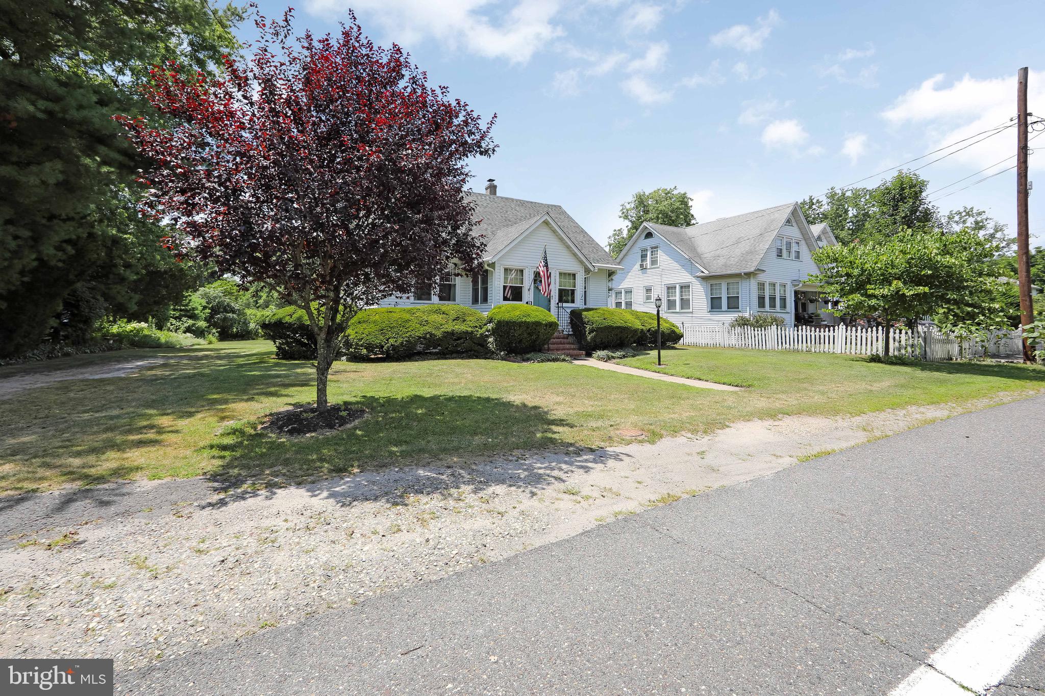 106 4 Mile Road Pemberton, NJ 08068 - Photo 41 of 42 a front view of a house with a yard and garage