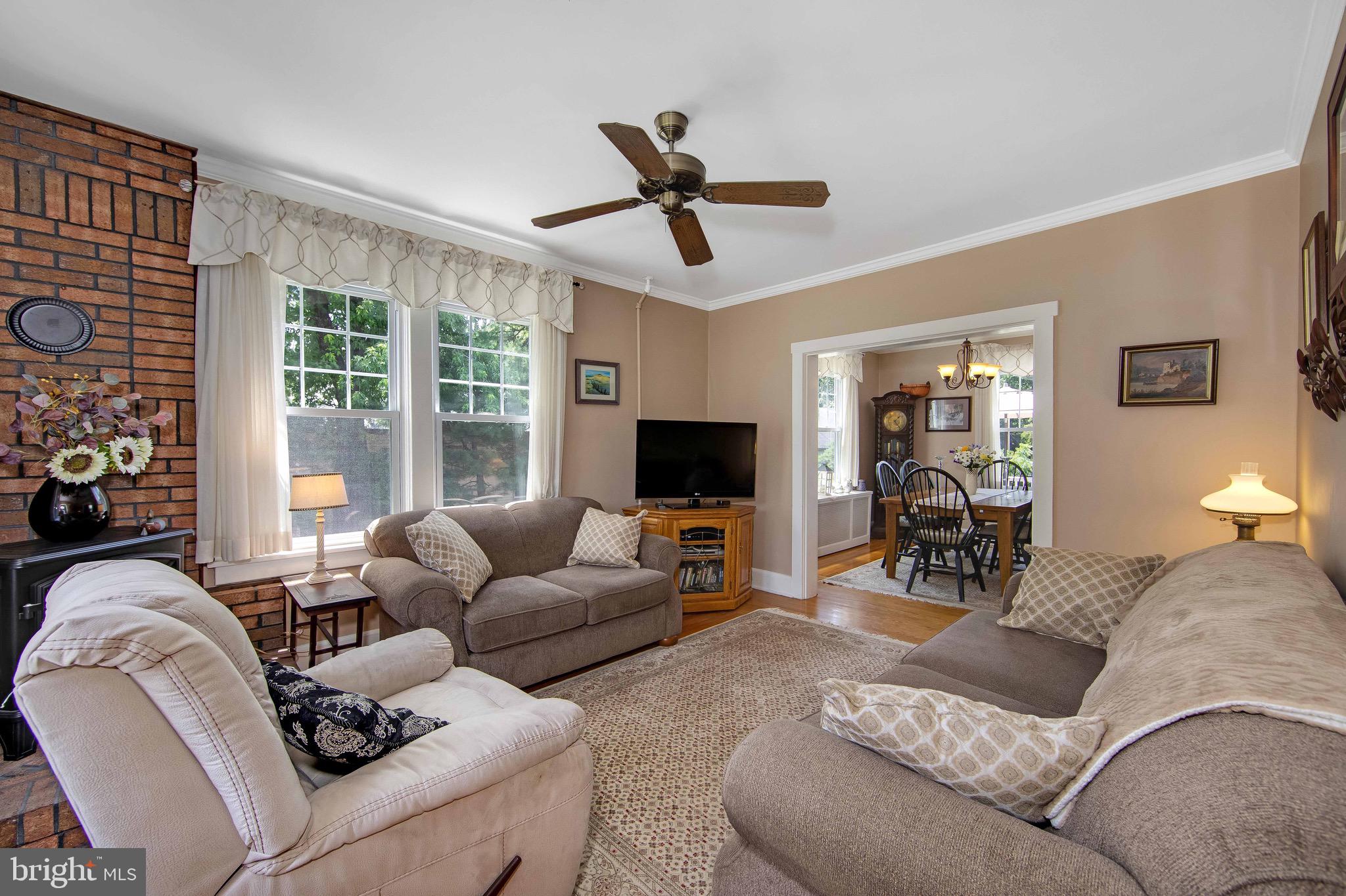106 4 Mile Road Pemberton, NJ 08068 - Photo 5 of 42 a living room with furniture and a flat screen tv
