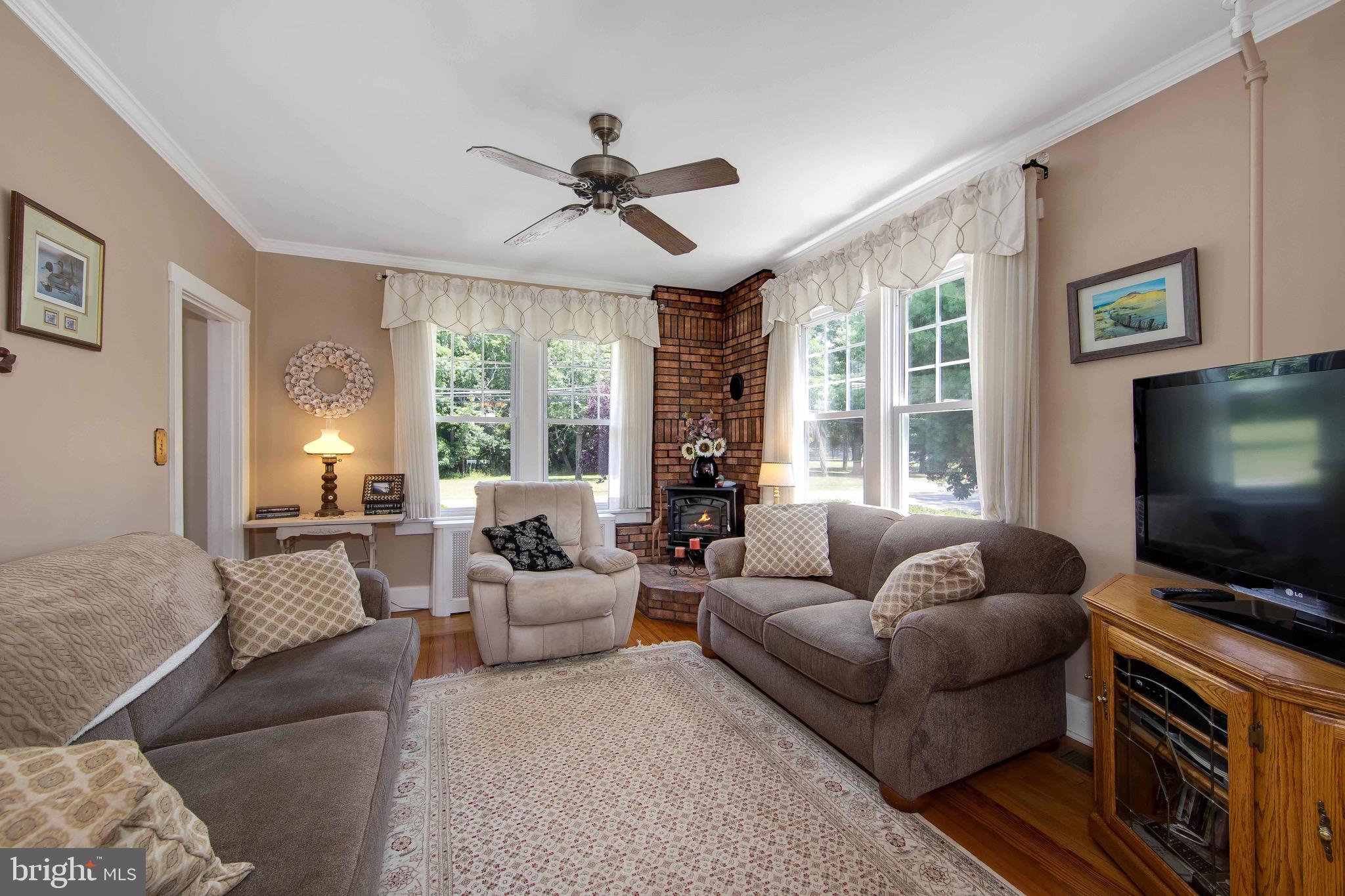 106 4 Mile Road Pemberton, NJ 08068 - Photo 6 of 42 a living room with furniture and a flat screen tv