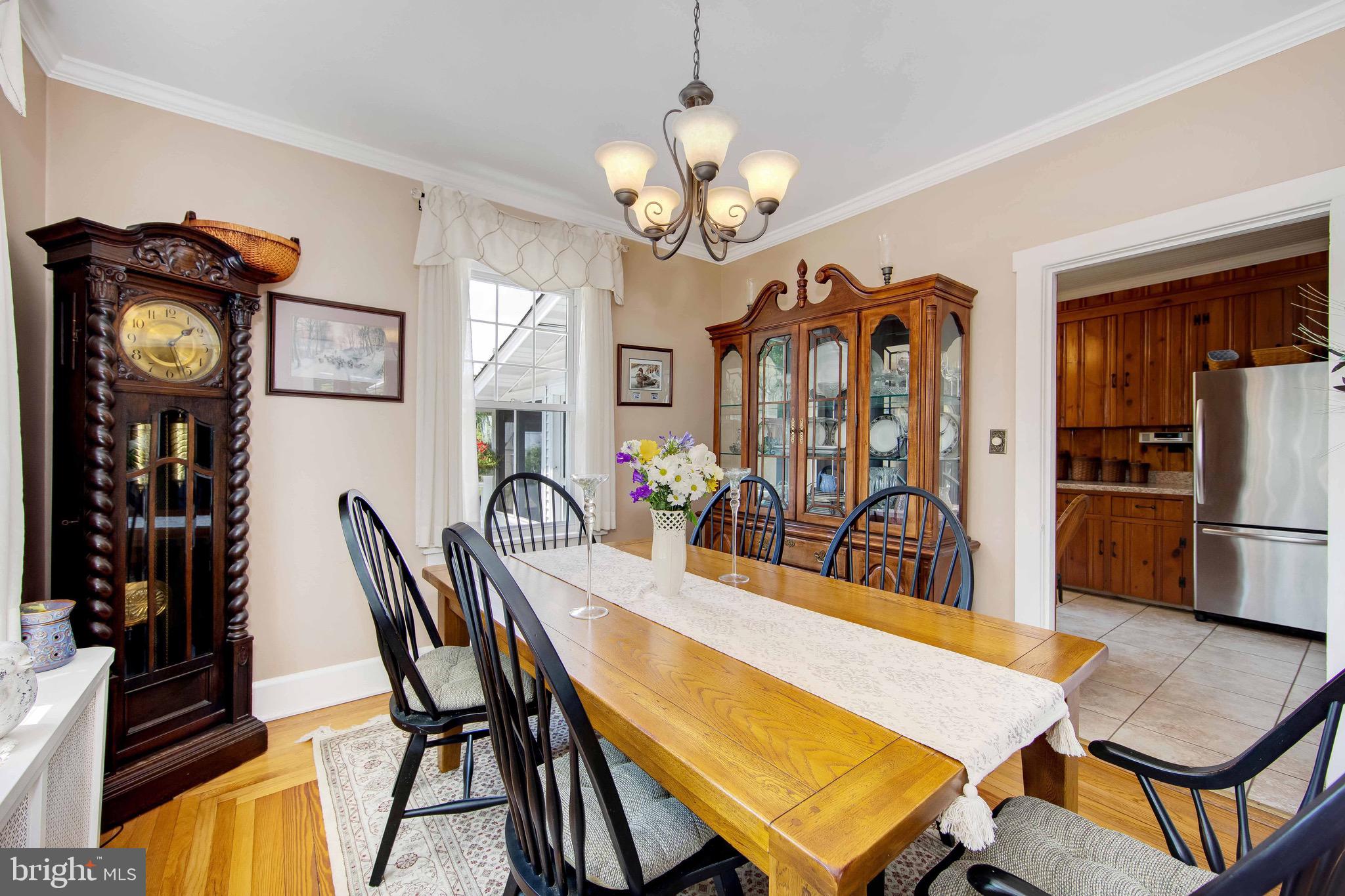 106 4 Mile Road Pemberton, NJ 08068 - Photo 8 of 42 a view of a dining room with furniture and a chandelier