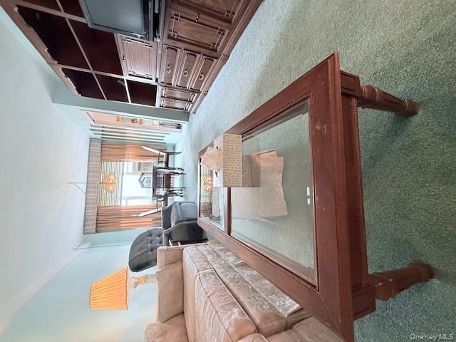 210-15 23rd Avenue, Unit 4E Queens, NY 11360 - Photo 3 of 8 a living room with furniture