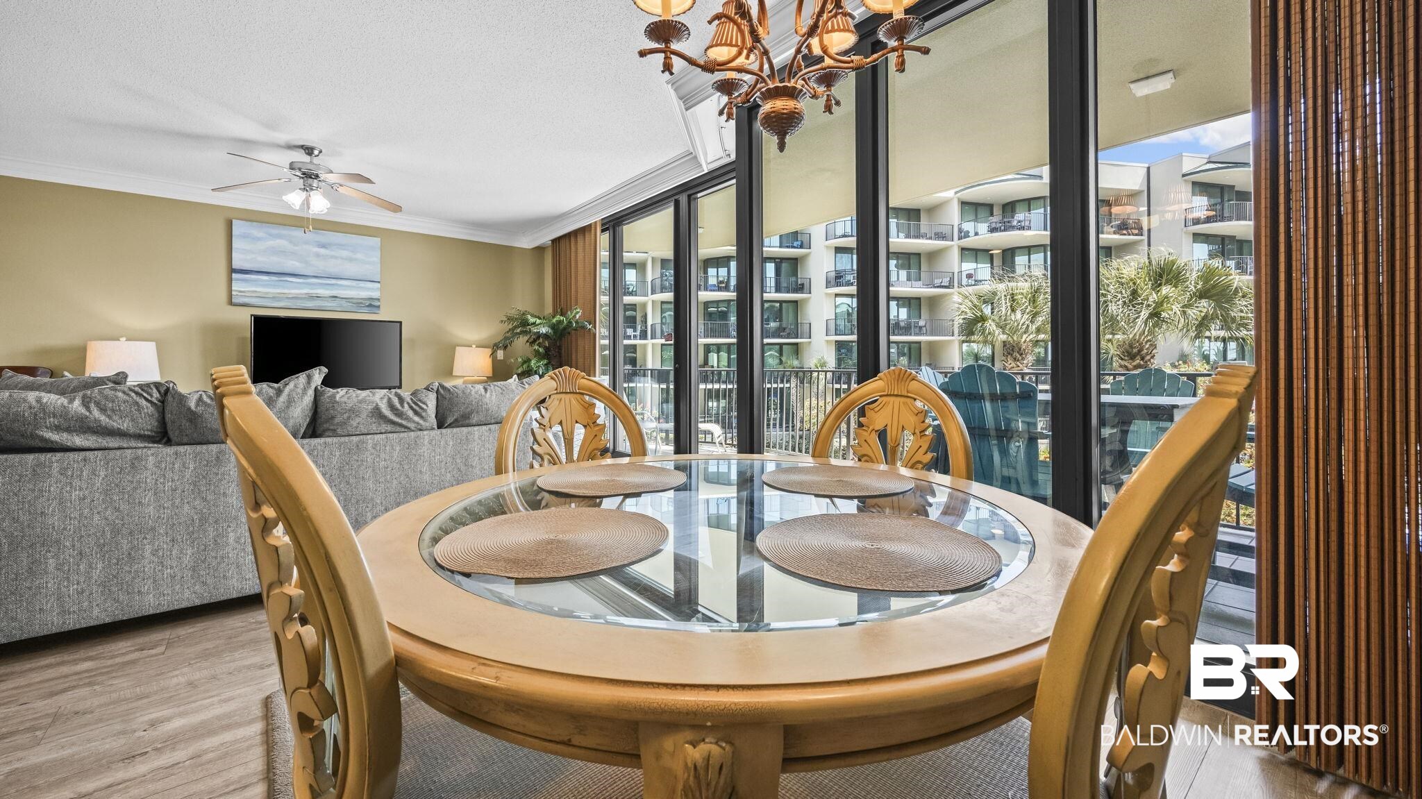 27580 Canal Road, Unit 214 BS 62 Orange Beach, AL 36561 - Photo 5 of 23 Dining space featuring ornamental molding, a ceiling fan, and light wood-style flooring