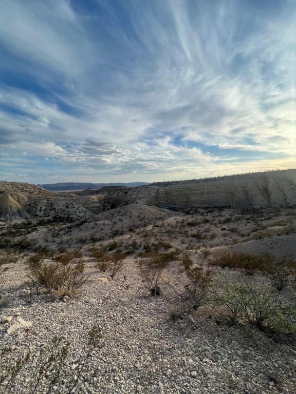 0 Patchouli Gulch Road Terlingua, TX 79852 - Photo 13 of 20 a view of a dry yard with wooden fence