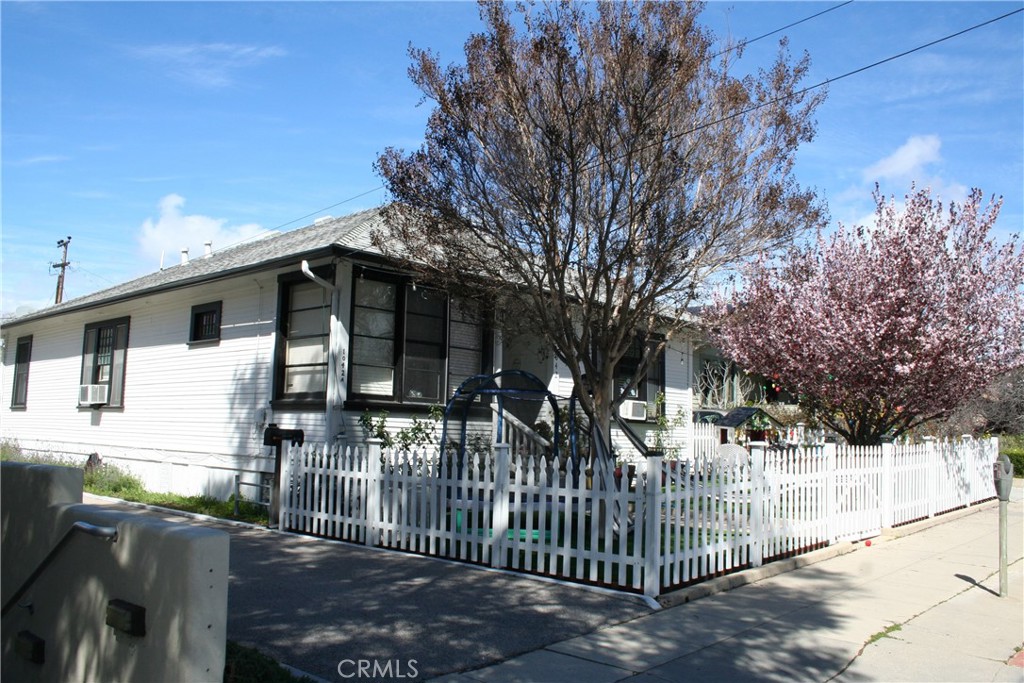 1042 Pismo Street San Luis Obispo, CA 93401 - Photo 1 of 20 a view of white house with large trees
