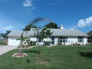 17236 3rd Street Montverde, FL 34756 - Photo 1 of 29 a front view of a house with a garden