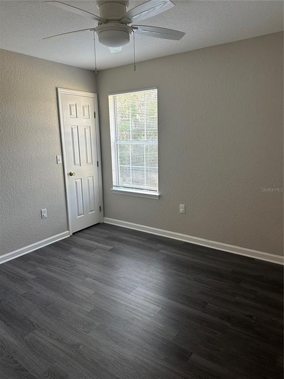 17236 3rd Street Montverde, FL 34756 - Photo 13 of 29 an empty room with wooden floor and windows