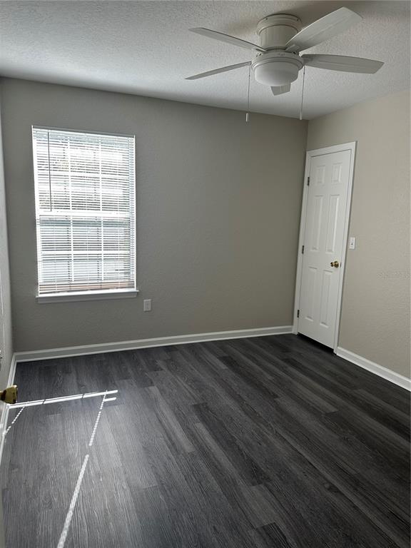 17236 3rd Street Montverde, FL 34756 - Photo 14 of 29 an empty room with wooden floor and windows