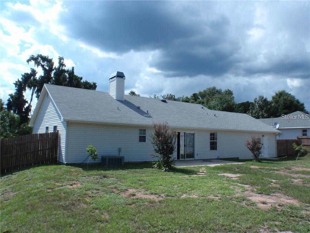 17236 3rd Street Montverde, FL 34756 - Photo 19 of 29 front view of a house with a yard