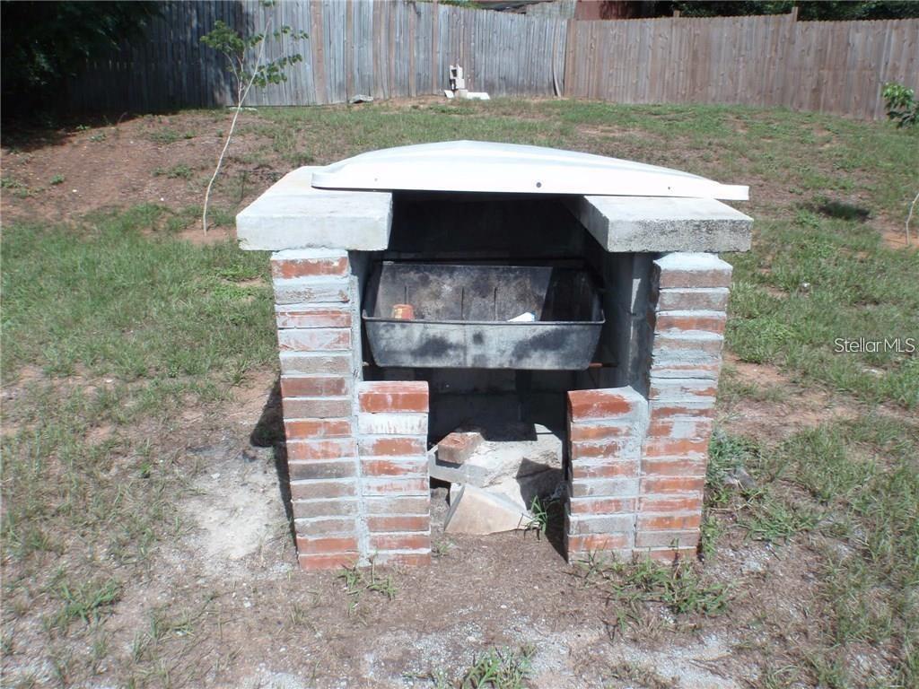 17236 3rd Street Montverde, FL 34756 - Photo 22 of 29 a view of backyard with a sink and a fireplace