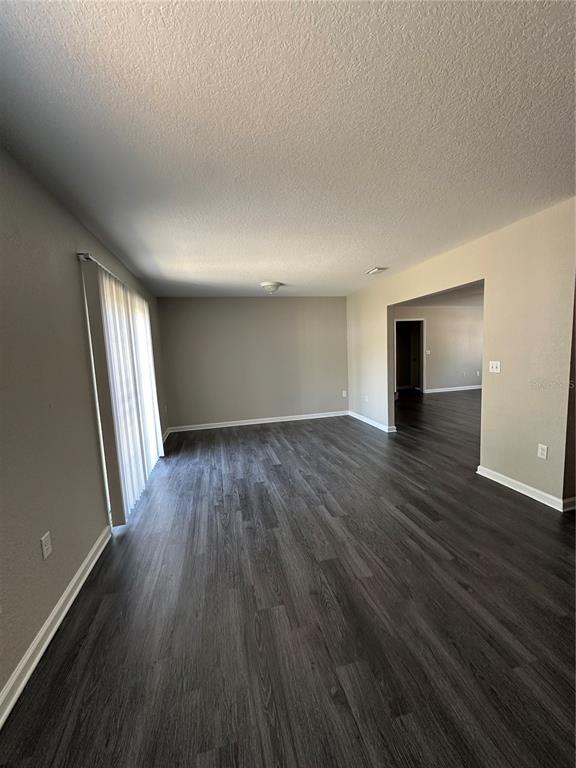 17236 3rd Street Montverde, FL 34756 - Photo 8 of 29 wooden floor in an empty room with a window