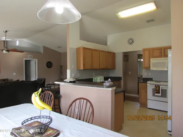 a view of a dining room with furniture