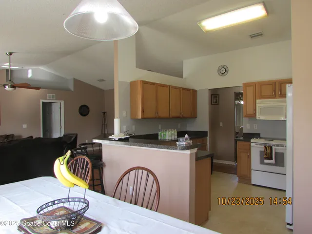 a view of a dining room with furniture