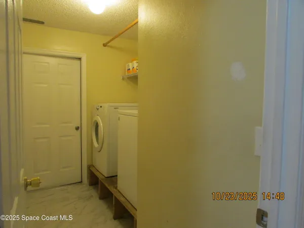 a bathroom with a granite countertop shower and a sink