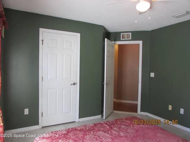 a bathroom with a sink a toilet and shower curtain