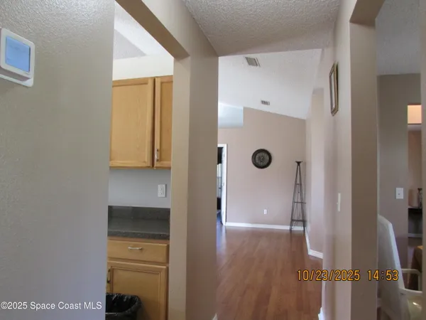 a kitchen with stainless steel appliances granite countertop a refrigerator and a stove